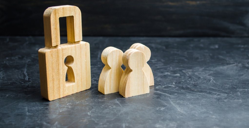 A,Group,Of,People,Near,The,Wooden,Padlock.,The,Concept
