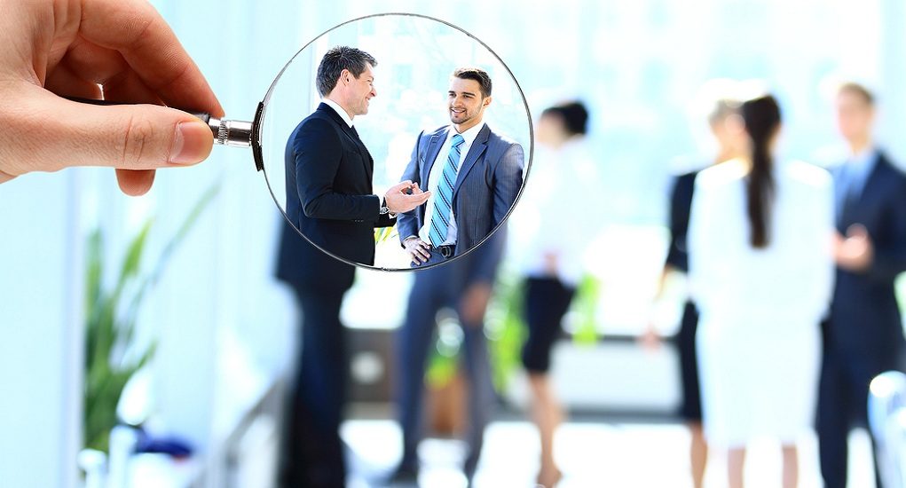 Magnifying,Glass,And,Businessman,In,Focus