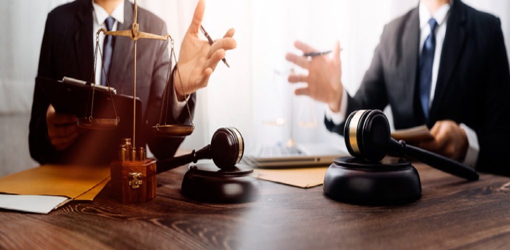 Business,And,Lawyers,Discussing,Contract,Papers,With,Brass,Scale,On