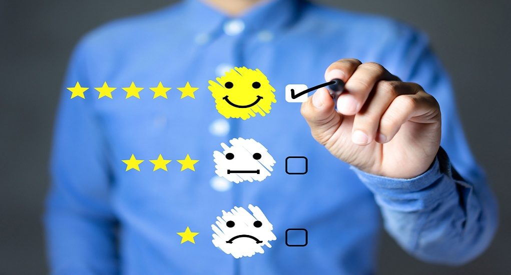 Businessman,Hand,Putting,Check,Mark,A,Checkbox,On,Happy,Face