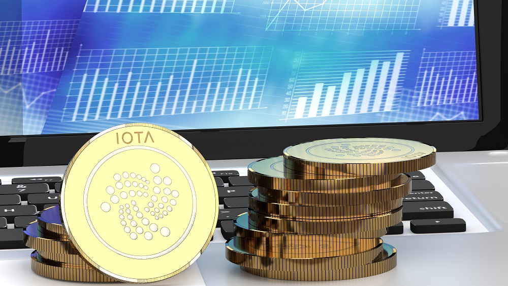 Stack,Of,Golden,Iota,Coins,,Bitcoin,Alternatives,,On,A,Laptop