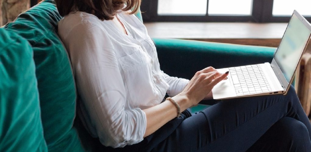 Business,Woman,In,White,Shirt,Working,At,Laptop,At,Home