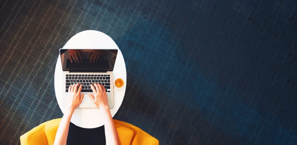 Person,Working,On,A,Laptop,Computer,In,A,Modern,Room