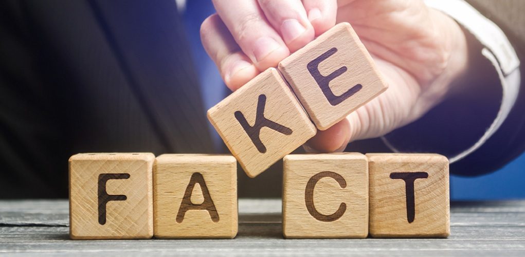 A,Man,Puts,Wooden,Blocks,With,The,Words,Fact,And